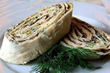 Roll s lavash s gljivama, sirom i začinskim biljem. Grickajte Silvestrovo